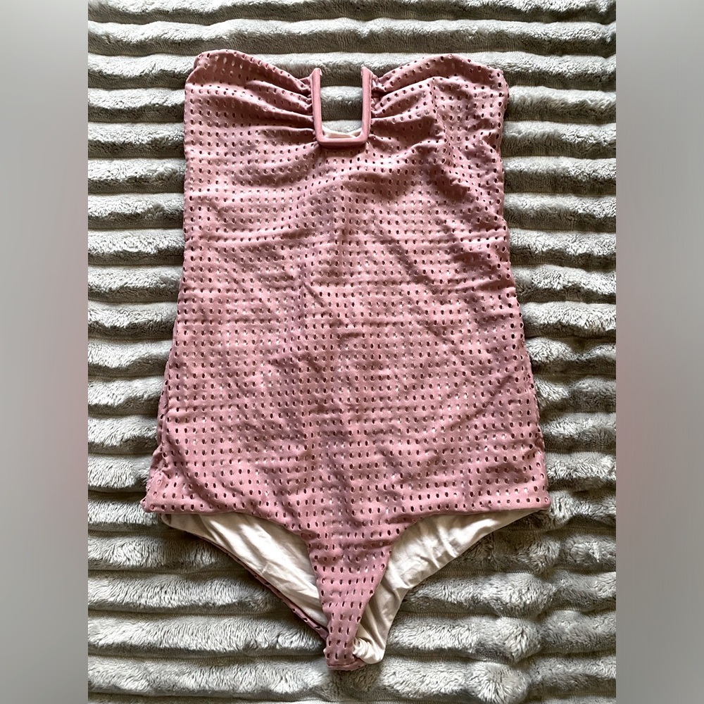 acaica one piece , small hole on the side